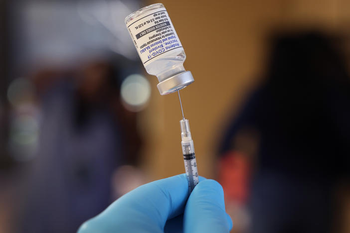 A pharmacist prepares to administer COVID-19 vaccine booster shots during an event hosted by the Chicago Department of Public Health at the Southwest Senior Center on September 09, 2022 in Chicago, Illinois.
