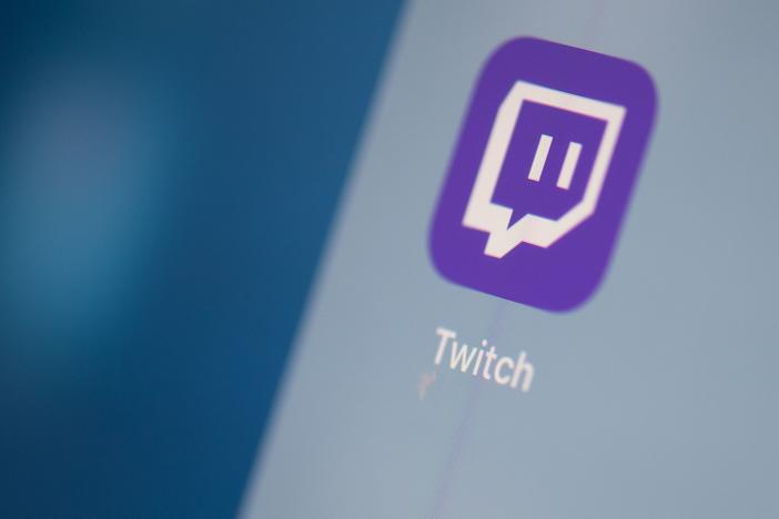 A Twitch logo is seen on the screen of a tablet in this 2019 photo.