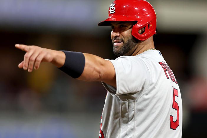 Albert Pujols of the St. Louis Cardinals points to the San Diego Padres dugout after hitting a single during the ninth inning of Tuesday night's game in San Diego. He ended the night with two singles, a walk and no home runs.