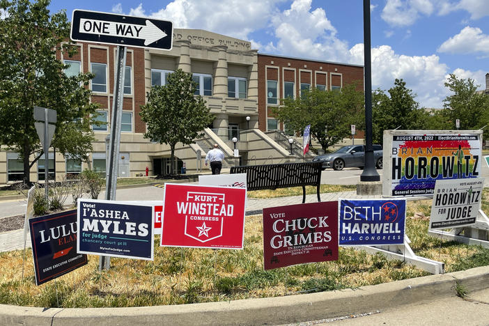 Campaign signs are posted outside a polling location on the first day of early voting on July 15 in Nashville, Tenn.