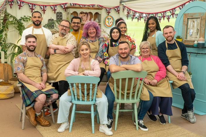 Group photo of Bakers in the Tent (L to R) (back) Sandro, William, Abdul, Carol, Maisam, Syabira, Maxy (front) James Rebs Janusz, Dawn, Kevin on <em>The Great British Baking Show</em> on Netflix<em>.</em>