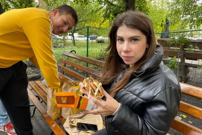 Yaroslav Holovatenko (left) and a friend with their McDonald's meals in Kyiv on Wednesday.