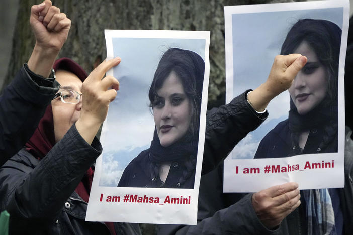 Protesters gather in front of the embassy of Iran in Berlin, on Tuesday after the death of 22-year-old Mahsa Amini in the custody of Iran's morality police.