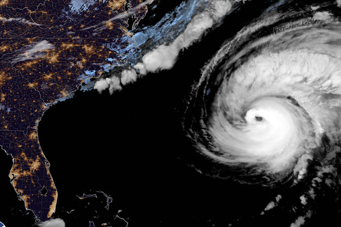 This image provided by the National Hurricane Center National Oceanic and Atmospheric Administration shows a satellite view as Hurricane Fiona moves up the United States Atlantic coast, Thursday night, Sept. 22, 2022.