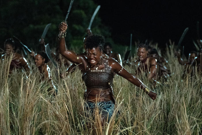 The general Nanisca, portrayed by Viola Davis, is the star of <em>The Woman King. </em>When a man objects to her influence, she retorts: "If the king respects me, it is because I have earned it."