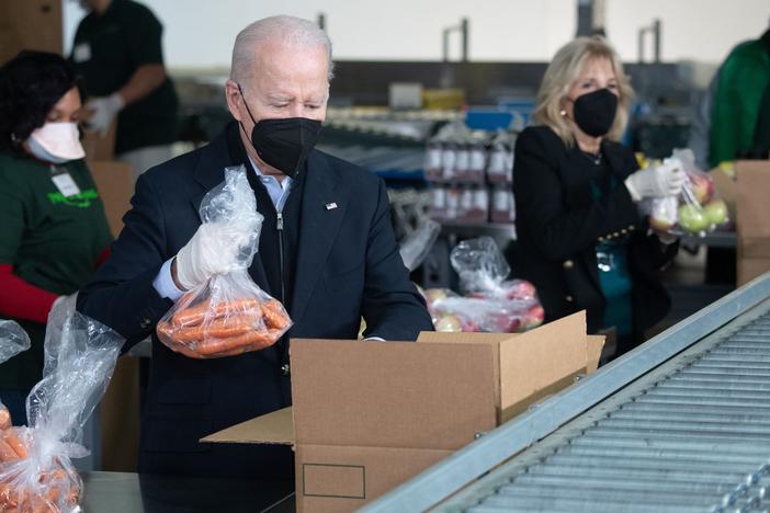 President Biden and first lady Jill Biden pack food boxes while volunteering on Martin Luther King, Jr., Day of Service in Philadelphia, Pennsylvania on Jan. 16, 2022.