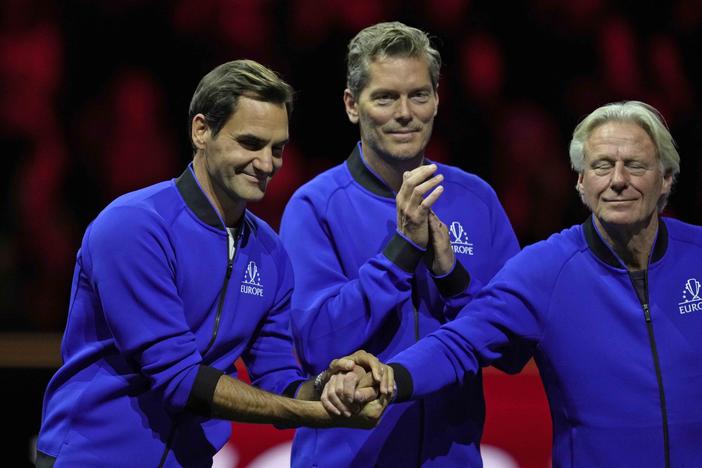 Team Europe's captain Bjorn Borg, right, holds the hands of his player Roger Federer at the end of the Laver Cup tennis tournament at the O2 arena in London on Sunday.