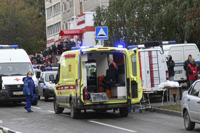 Police and paramedics work at the scene of a shooting at school No. 88 in Izhevsk, Russia, Monday, Sept. 26, 2022. A gunman on Monday morning killed 13 people and wounded 21 others in a school in central Russia, authorities said.