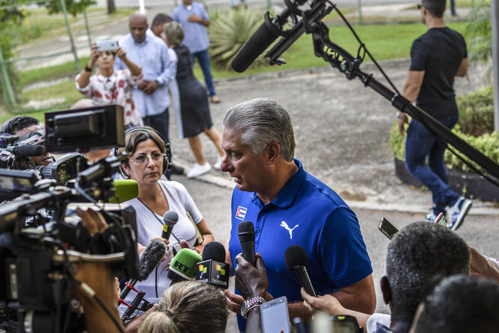 Cuba's President Miguel Díaz-Canel speaks to the press on Sunday after casting his vote at a polling station in Havana during the new family law referendum.