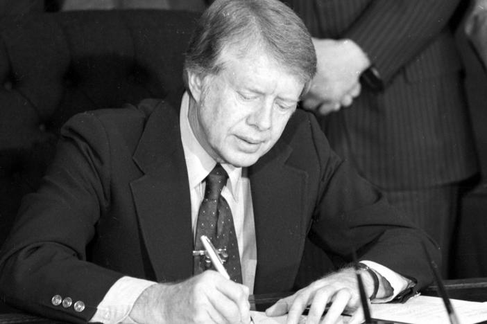 President Jimmy Carter signs an emergency natural gas legislation in the Oval Office of the White House in Washington, D.C., in 1977.