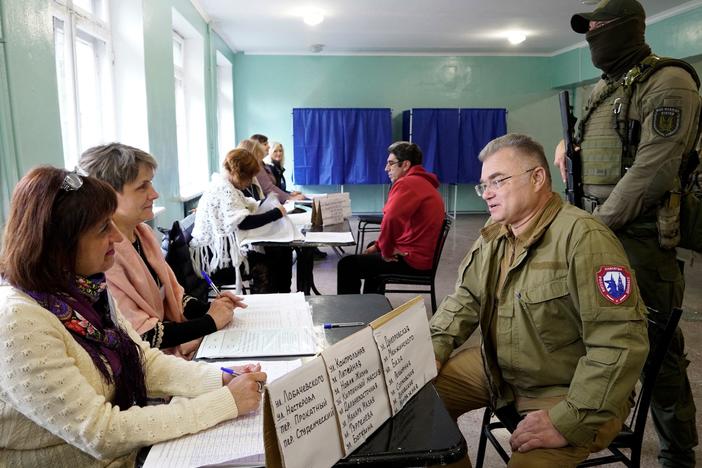 Konstantin Ivashchenko, former CEO of the Azovmash plant and appointed pro-Russian mayor of Mariupol, visits a polling station as people vote in a referendum in Mariupol on Tuesday.