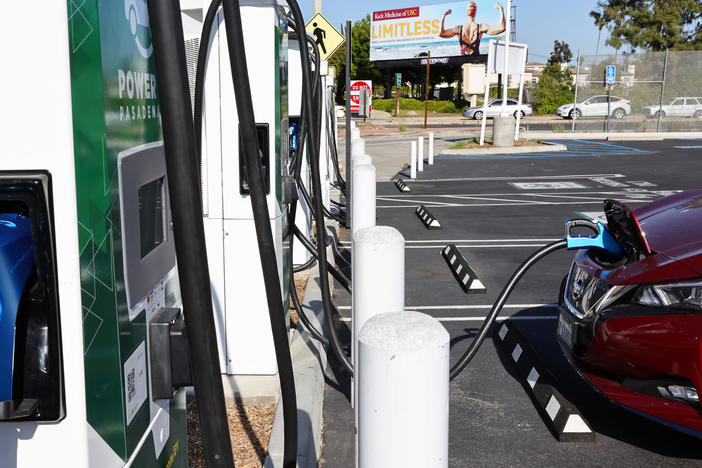 A Nissan electric vehicle recharges at a Power Up fast charger station on April 14, 2022, in Pasadena, Calif. California has more chargers than any other state in the U.S., but the federal government is trying to expand charger access across the country.