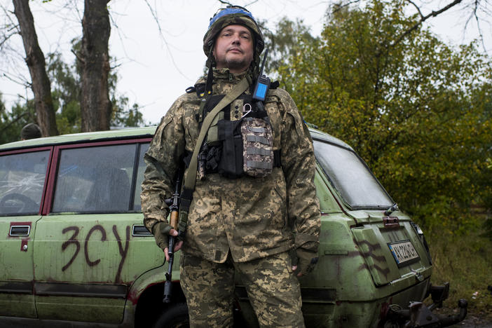 A soldier who was formerly an IT entrepreneur and asked to be identified only by his call sign "Arun" manning a checkpoint in Borshchova, in northeastern Ukraine, on Friday. Ukrainian troops took back the area from Russian forces earlier this month.