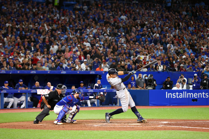 Aaron Judge of the New York Yankees hits his 61st home run of the season in the seventh inning against the Toronto Blue Jays at Rogers Centre on Sept. 28 in Toronto, Ontario, Canada. Judge has now tied Roger Maris for the American League record.