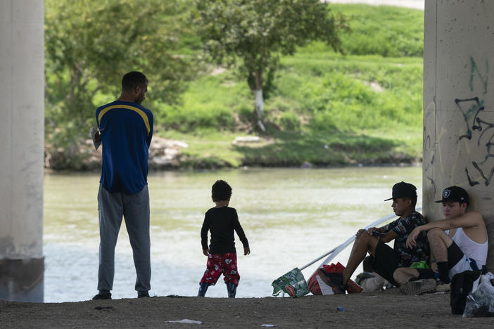 Migrants waiting to be picked up by the U.S. Border Patrol under an international bridge in Eagle Pass, Texas, earlier this month.