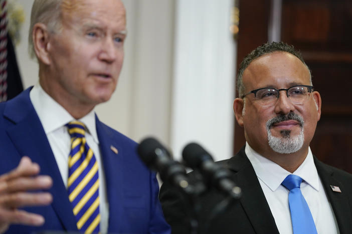 U.S. Education Secretary Miguel Cardona appeared alongside President Biden when he announced his student loan relief plan on Aug. 24. On Thursday, the administration quietly changed its guidance around which borrowers qualify for this relief.