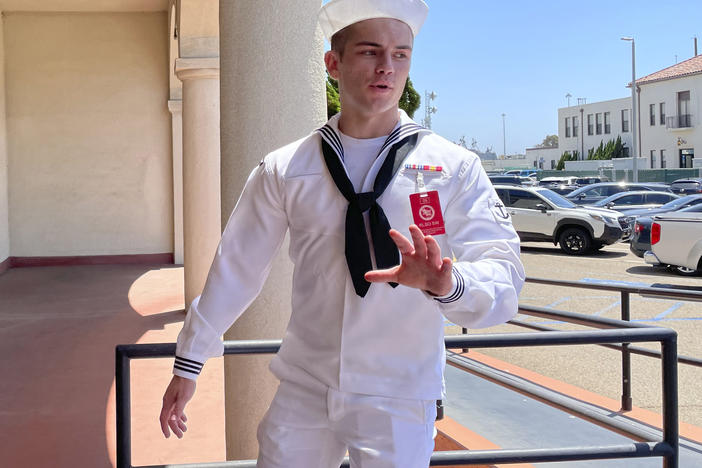 US Navy sailor Ryan Sawyer Mays walks past reporters at Naval Base San Diego before entering a Navy courtroom, Aug. 17, 2022, in San Diego.