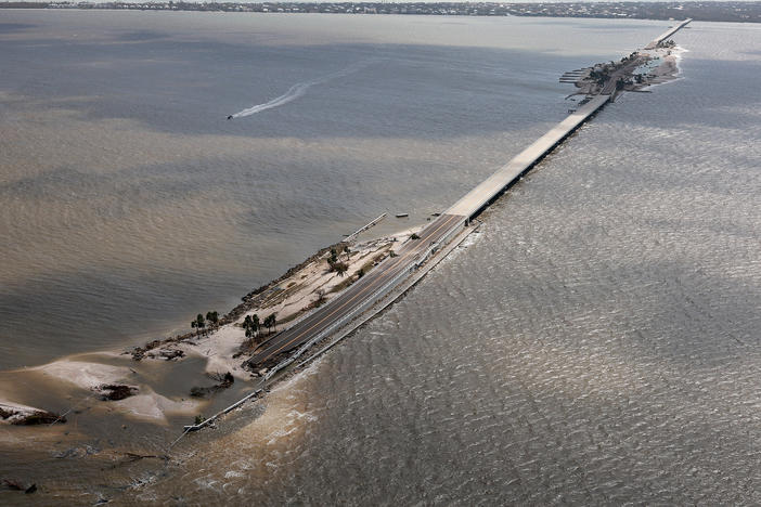 In this aerial photo taken in the aftermath of Hurricane Ian on Thursday, parts of the Sanibel Causeway are washed away along with sections of the bridge.