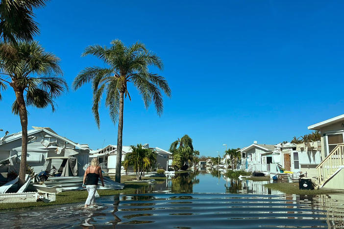 Francie Pucin stands near her home at the Palmetto Palms RV Resort in Fort Myers, Fla., on Saturday. She moved to the state from Illinois, expecting better weather.