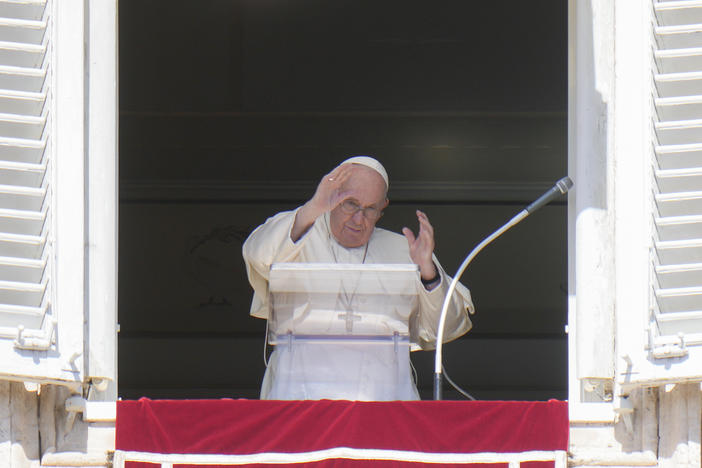 Pope Francis waves during the Angelus noon prayer from the window of his studio overlooking St. Peter's Square, at the Vatican on Sunday. He has appealed to Russian President Vladimir Putin, imploring him to "stop this spiral of violence and death" in Ukraine. The pontiff also called on Ukrainian President Volodymyr Zelenskyy to "be open" to serious peace proposals.