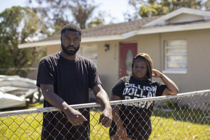 Ta'Wan Grant and Lexxus Cherry in the front yard of their home in the Dunbar neighborhood of Fort Myers, Fla., on Sunday.