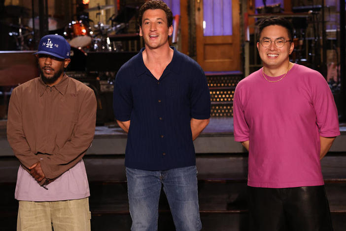Musical guest Kendrick Lamar, host Miles Teller, and Bowen Yang recording a promo for Saturday Night Live's 48th season opening episode.