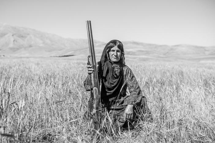 This gun held by 35-year-old Fatima was a wedding gift from her husband. Families of the nomadic Bakhtiari tribes of Iran may own several weapons, used to defend themselves and their livestock against thieves and wild animals. Fatima is known for her shooting and riding skills.