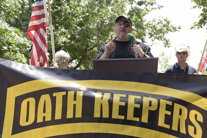 Stewart Rhodes, founder of the Oath Keepers, center, speaks during a rally outside the White House in Washington on June 25, 2017.