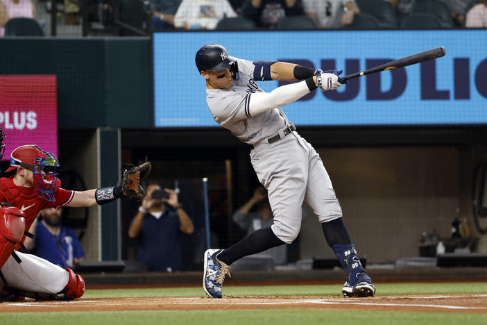Aaron Judge #99 of the New York Yankees hits his 62nd home run of the season against the Texas Rangers during the first inning in game two of a double header at Globe Life Field on Tuesday in Arlington, Texas.