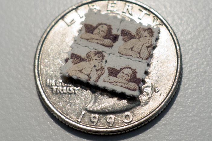 LSD blotter tabs sit on top of a US quarter coin. A drug based off of psychedelic LSD appears to relieve depression and anxiety in mice, but without the hallucinogenic side effects.