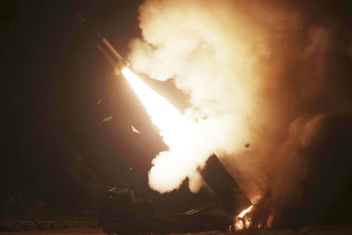 In this photo provided by South Korea Defense Ministry, an Army missile is fired during a joint military drill between U.S. and South Korea at an undisclosed location in South Korea, Wednesday, Oct. 5, 2022.