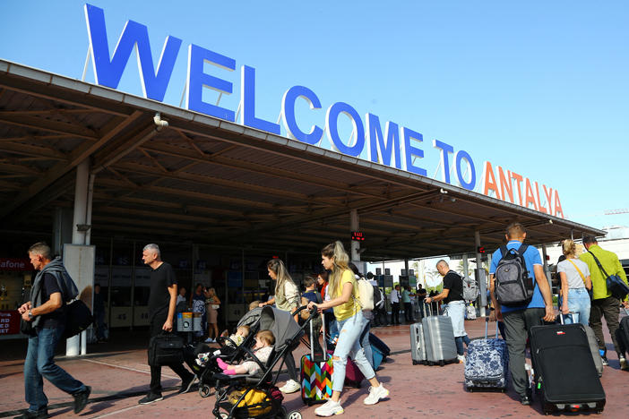 Tourists, coming mainly from Russia, at the arrival terminal at Antalya International Airport in the Mediterranean resort city of Antalya on Sept. 22, the day after Russian President Vladimir Putin announced a draft for Ukraine.