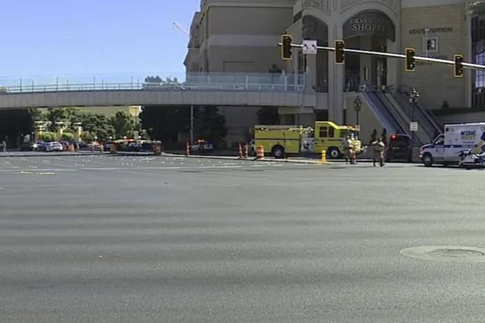 Emergency personnel respond the scene of a stabbing along the Las Vegas Strip on Thursday, Oct. 6, 2022. Police say one person has been fatally stabbed and at least five others wounded. A suspect is in custody.