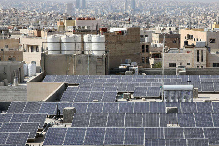U.S. Treasury Secretary Janet Yellen says international development banks need new strategies to help countries finance the transition to low-carbon sources of energy like this rooftop solar project in Jordan.