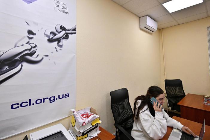 An employee of Ukraine's Center for Civil Liberties works in the office in Kyiv on Friday.