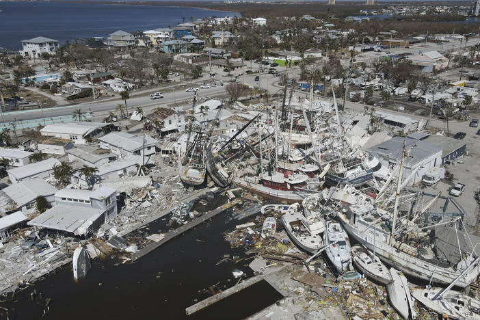 In this photo shot with a drone, shrimp boats lie grounded atop what was a mobile home park, following the passage of Hurricane Ian, on San Carlos Island in Fort Myers Beach, Fla., Friday, Oct. 7, 2022.