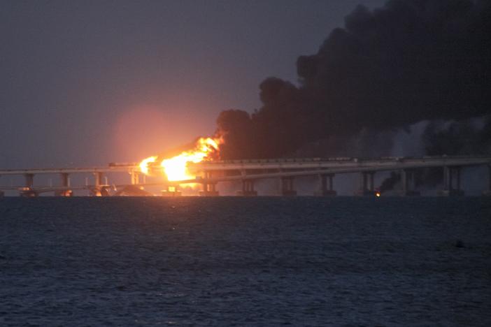 Flame and smoke rise from the bridge connecting the Russian mainland and the Crimean peninsula early Saturday.