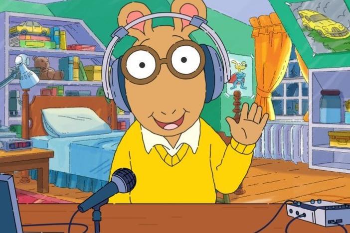 In a digital short previewing the podcast, Arthur shows his audio equipment and once again, his headphones are not on his actual ears.