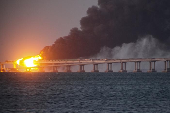Flame and smoke rise fron Crimean Bridge connecting the Russian mainland and Crimean peninsula over the Kerch Strait, in Kerch, Crimea, on Saturday.