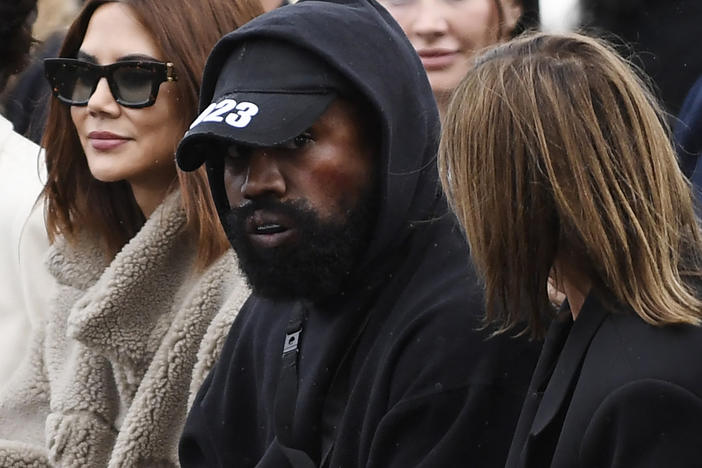 Ye attending Paris Fashion Week, where he ignited controversy wearing a shirt with the slogan "White Lives Matter."