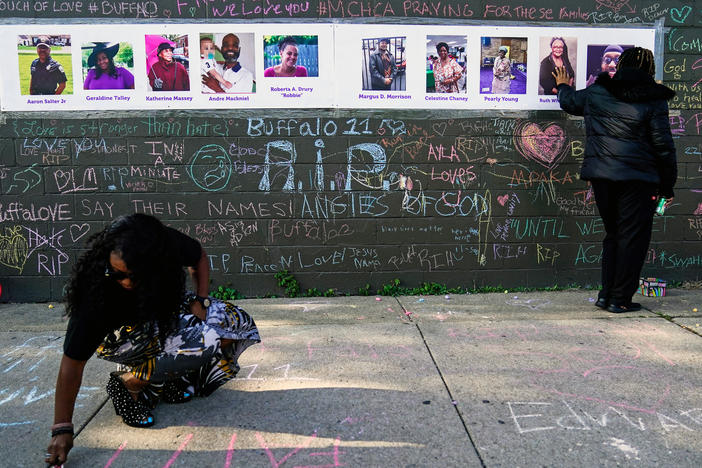 The gunman charged with killing 10 Black people and injuring three other individuals in the mass shooting at a Buffalo, N.Y., supermarket in May will not be pursuing a psychiatric defense in his state case, officials say. Here, people pay their respects at a makeshift memorial near the scene of the mass shooting a few days after it occurred.