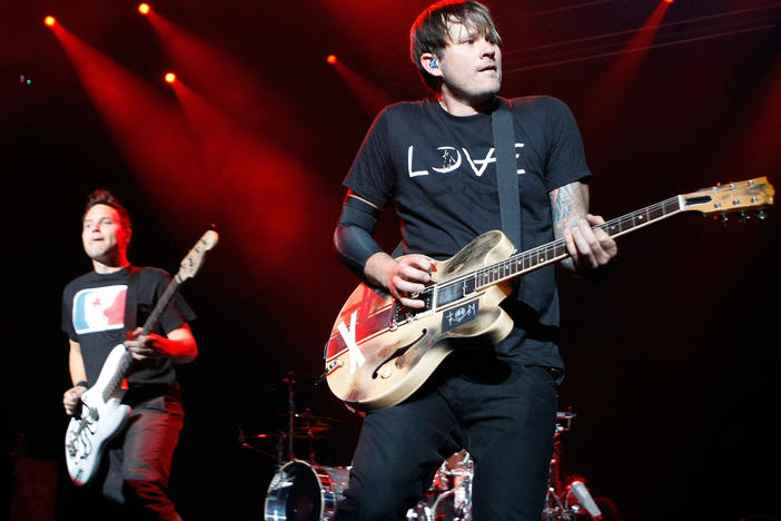 Blink-182 singer/bassist Mark Hoppus (L) and singer/guitarist Tom DeLonge perform in 2009. The band confirmed the classic lineup would once again reunite.