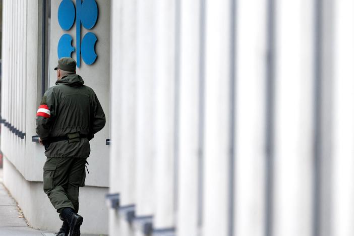 An Austrian soldier guards the entrance of the OPEC headquarters in Vienna on October 4, on the eve of the 45th Meeting of the Joint Ministerial Monitoring Committee and the 33rd OPEC and non-OPEC Ministerial Meeting. OPEC and its allies agreed to reduce their production quotas at that meeting.