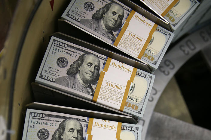 Journalist Jacob Goldstein traces the advent of paper money back to 1000 AD China. Above, $100 notes are printed at the Bureau of Engraving and Printing in Washington, D.C.