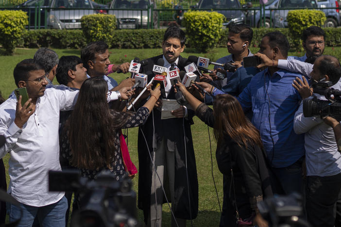 Aftab Ali Khan, a lawyer representing one of the petitioners briefs media persons at the Supreme Court premises in New Delhi, India, Thursday, Oct. 13, 2022.