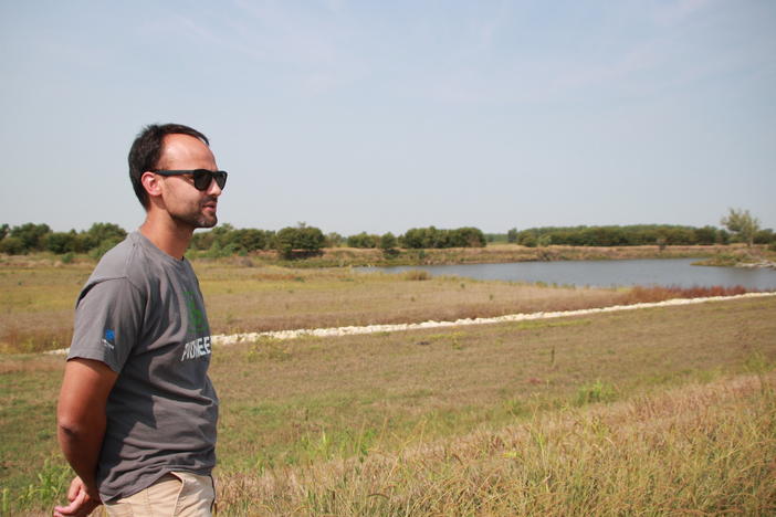 Flooding levee district board member Regan Griffin surveys his farmland in Atchison County, Missouri on Sept. 14, 2022. A pond marks where a levee was breached during the 2019 flood of the Missouri River, flooding Griffin's farmland. The board hopes to set this levee back in the future.
