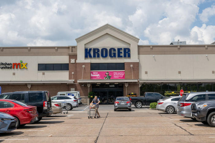 A customer exits a Kroger grocery store on Sept. 9 in Houston, Tx.