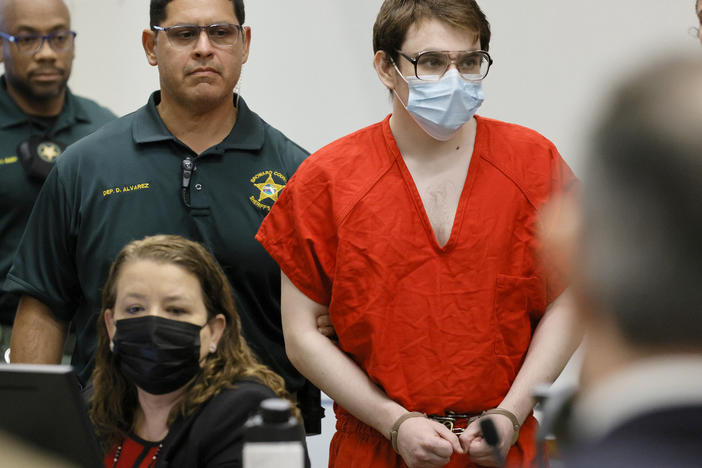 Marjory Stoneman Douglas High School shooter Nikolas Cruz is escorted into the courtroom for a hearing regarding possible jury misconduct during deliberations in the penalty phase of his trial on Oct. 14, 2022, in Fort Lauderdale, Fla.