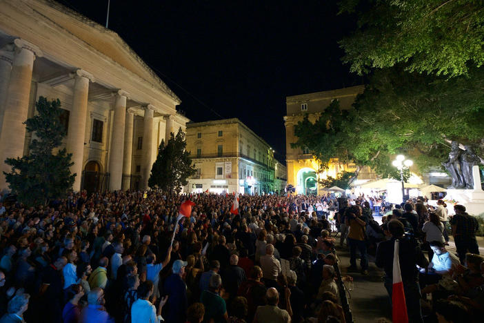 People attend a gathering to remember Daphne Caruana Galizia, at La Valletta, in Malta. Malta is marking the fifth anniversary of the car bomb slaying of the investigative journalist.