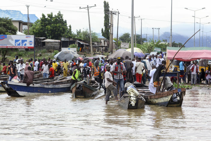 People stranded due to floods following several days of downpours In Kogi, Nigeria, on Oct. 6.